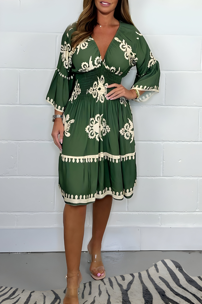 Women's boho dress in army green with a flowing skirt, styled for casual and smart-casual outfits.
