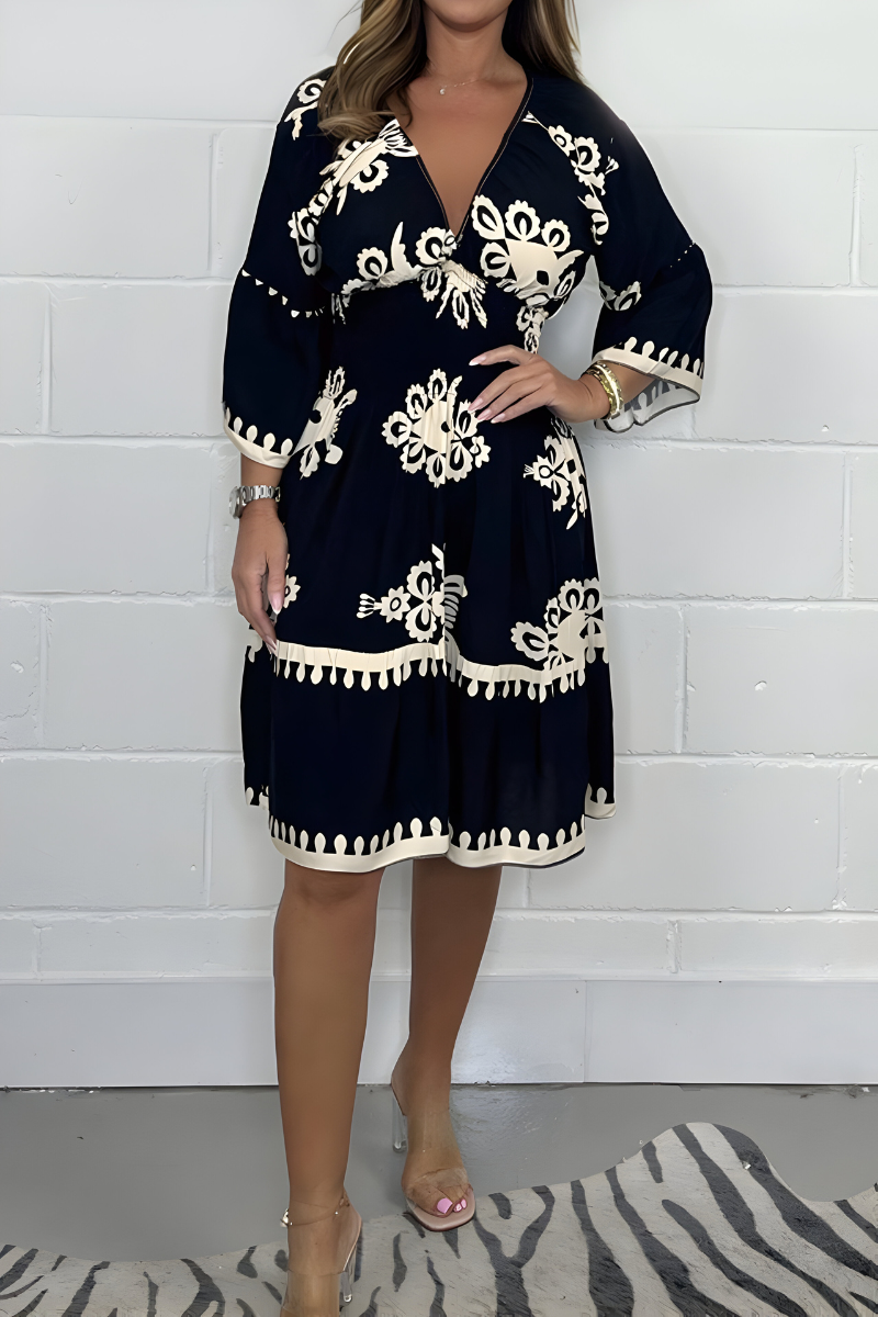 Women's boho dress in black with a flowing skirt, styled for casual and smart-casual outfits.