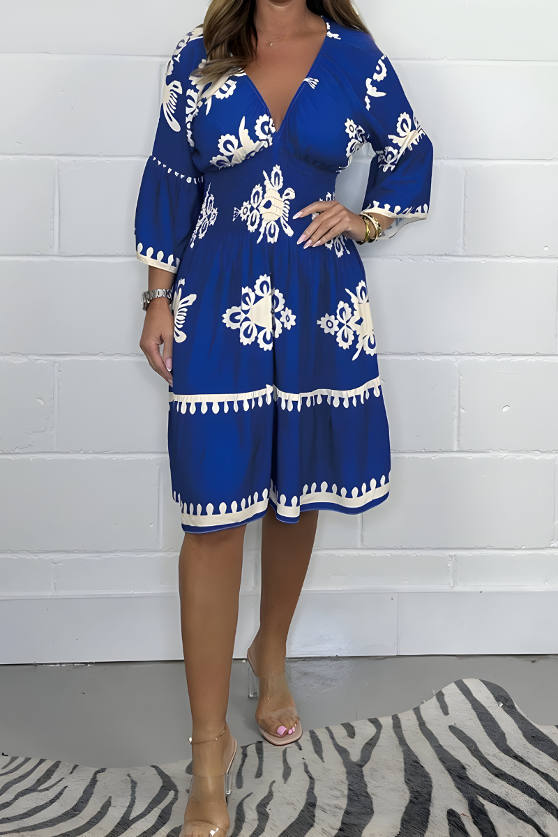 Women's boho dress in blue with a flowing skirt, styled for casual and smart-casual outfits.