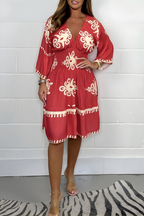 Women's boho dress in red with a flowing skirt, styled for casual and smart-casual outfits.
