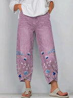 Women's casual trousers in purple with a relaxed fit, styled for casual and smart-casual outfits.