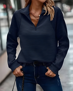 Women's pullover jumper in navy with a modern fit, styled for casual and smart-casual outfits.