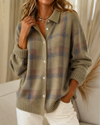 Women's knitted cardigan in brown with check pattern, styled for casual and smart-casual outfits.