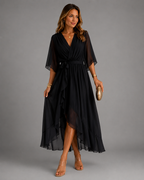 Women's chiffon maxi dress in black with wrap front, styled for casual and smart-casual outfits.