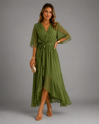 Women's chiffon maxi dress in green with wrap front, styled for casual and smart-casual outfits.