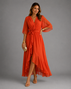 Women's chiffon maxi dress in orange red with wrap front, styled for casual and smart-casual outfits.