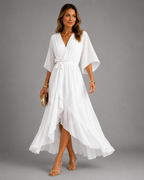 Women's chiffon maxi dress in white with wrap front, styled for casual and smart-casual outfits.
