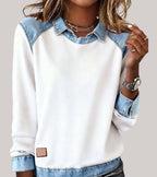 Women's denim-look jumper in white with contrast denim cuffs, styled for casual and smart-casual outfits.