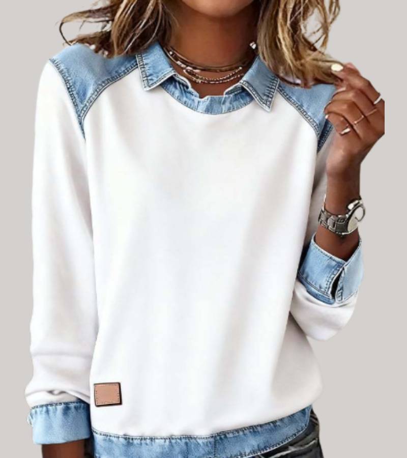 Women's denim-look jumper in white with contrast denim cuffs, styled for casual and smart-casual outfits.