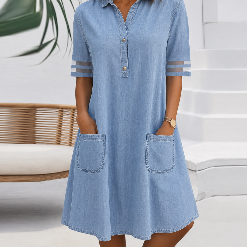 Women's shirt dress in blue with half button placket, styled for casual and smart-casual outfits.