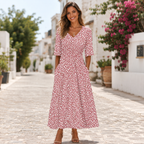 Women's midi dress in pink with draped waist detail, styled for casual and smart-casual outfits.