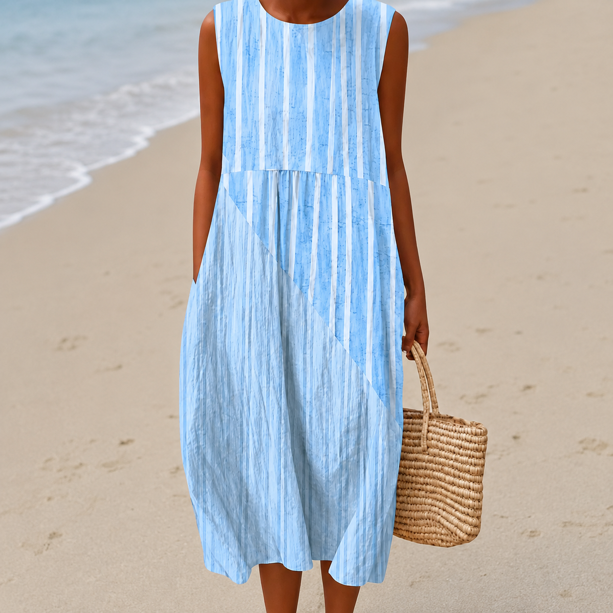 Women's midi dress in light blue with a painterly floral print, styled for casual and smart-casual outfits.