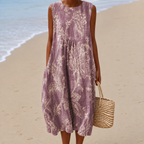 Women's midi dress in mauve with a sleeveless floral design, styled for casual and smart-casual outfits.