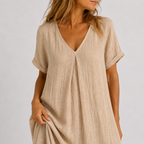 Women's maxi dress in peacock green with V-neckline, styled for casual and smart-casual outfits.