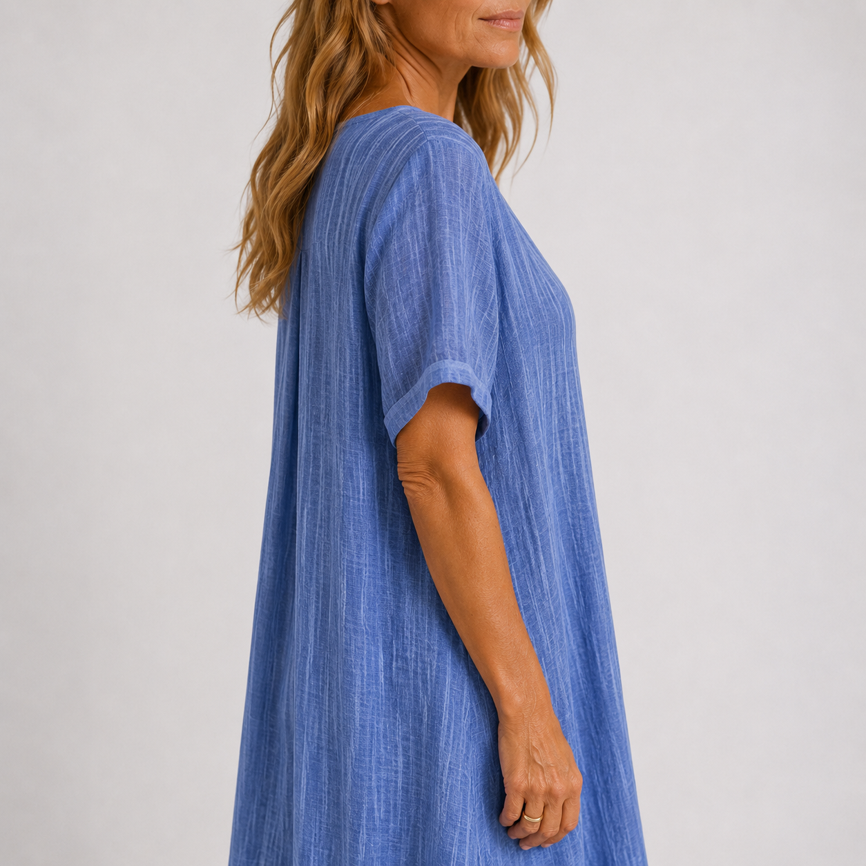 Women's maxi dress in peacock green with V-neckline, styled for casual and smart-casual outfits.