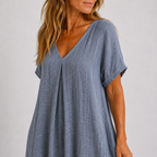 Women's maxi dress in peacock green with V-neckline, styled for casual and smart-casual outfits.