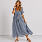 Women's maxi dress in grey with V-neckline, styled for casual and smart-casual outfits.