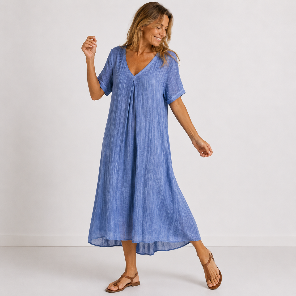 Women's maxi dress in navy blue with V-neckline, styled for casual and smart-casual outfits.