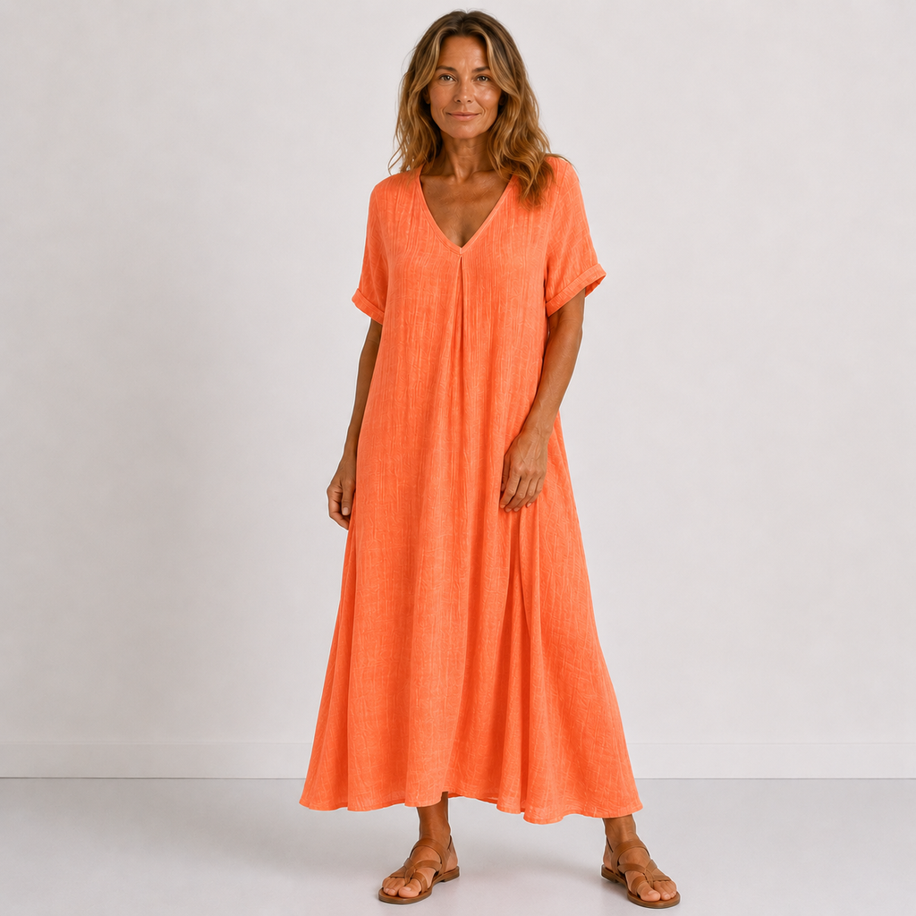 Women's maxi dress in orange red with V-neckline, styled for casual and smart-casual outfits.