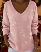 Women's knitted jumper in pink with glitter ribbed knit, styled for casual and smart-casual outfits.