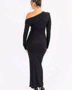 Women's maxi dress in black with a glittering finish, styled for evening and smart-casual outfits.