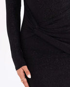 Women's maxi dress in black with a glittering finish, styled for evening and smart-casual outfits.