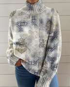 Women's knitted jumper in grey with graphic print, styled for casual and smart-casual outfits.