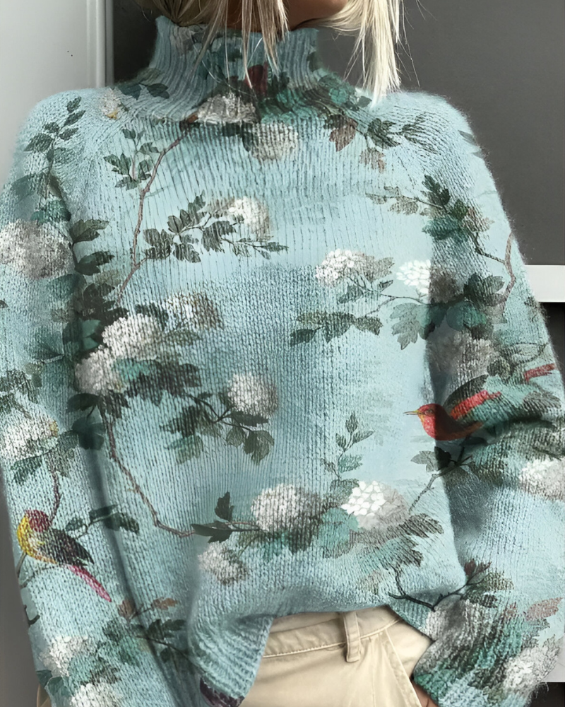 Women's knitted jumper in sea blue with graphic print, styled for casual and smart-casual outfits.