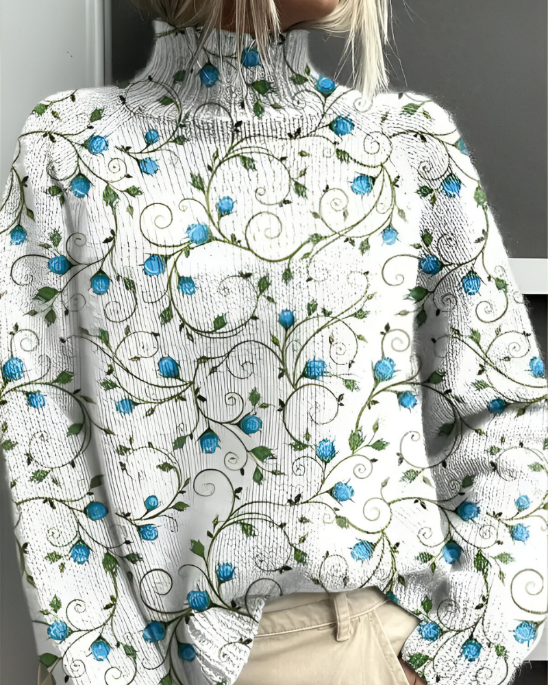 Women's knitted jumper in white with graphic print, styled for casual and smart-casual outfits.