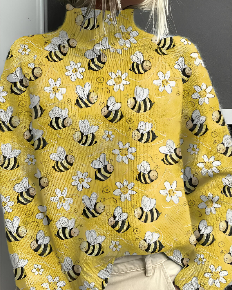 Women's knitted jumper in yellow with graphic print, styled for casual and smart-casual outfits.