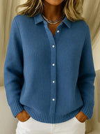 Women's knitted jumper in blue with collar, styled for casual and smart-casual outfits.