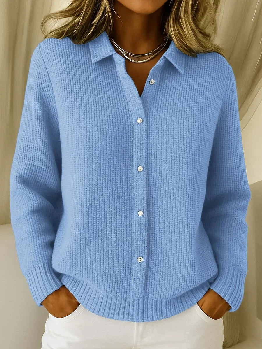 Women's knitted jumper in light blue with collar, styled for casual and smart-casual outfits.