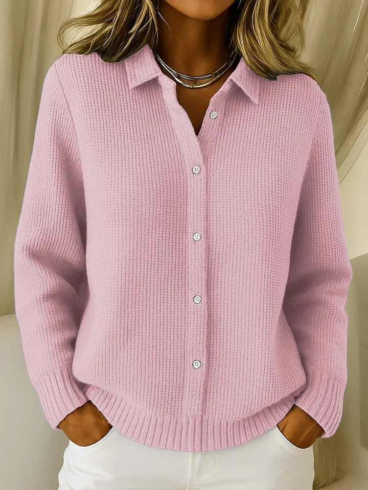 Women's knitted jumper in pink with collar, styled for casual and smart-casual outfits.