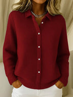 Women's knitted jumper in red with collar, styled for casual and smart-casual outfits.