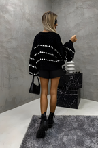 Women's knitted jumper in brown with a timeless pullover design, styled for casual and smart-casual outfits.