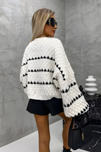 Women's knitted jumper in brown with a timeless pullover design, styled for casual and smart-casual outfits.