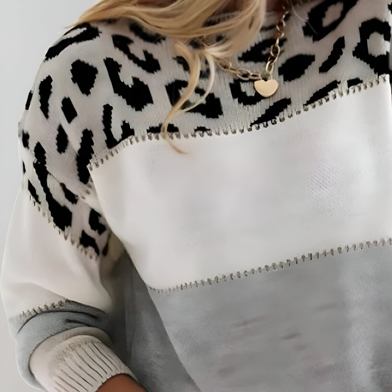 Women's knitted jumper in grey with a modern knit structure, styled for casual and smart-casual outfits.