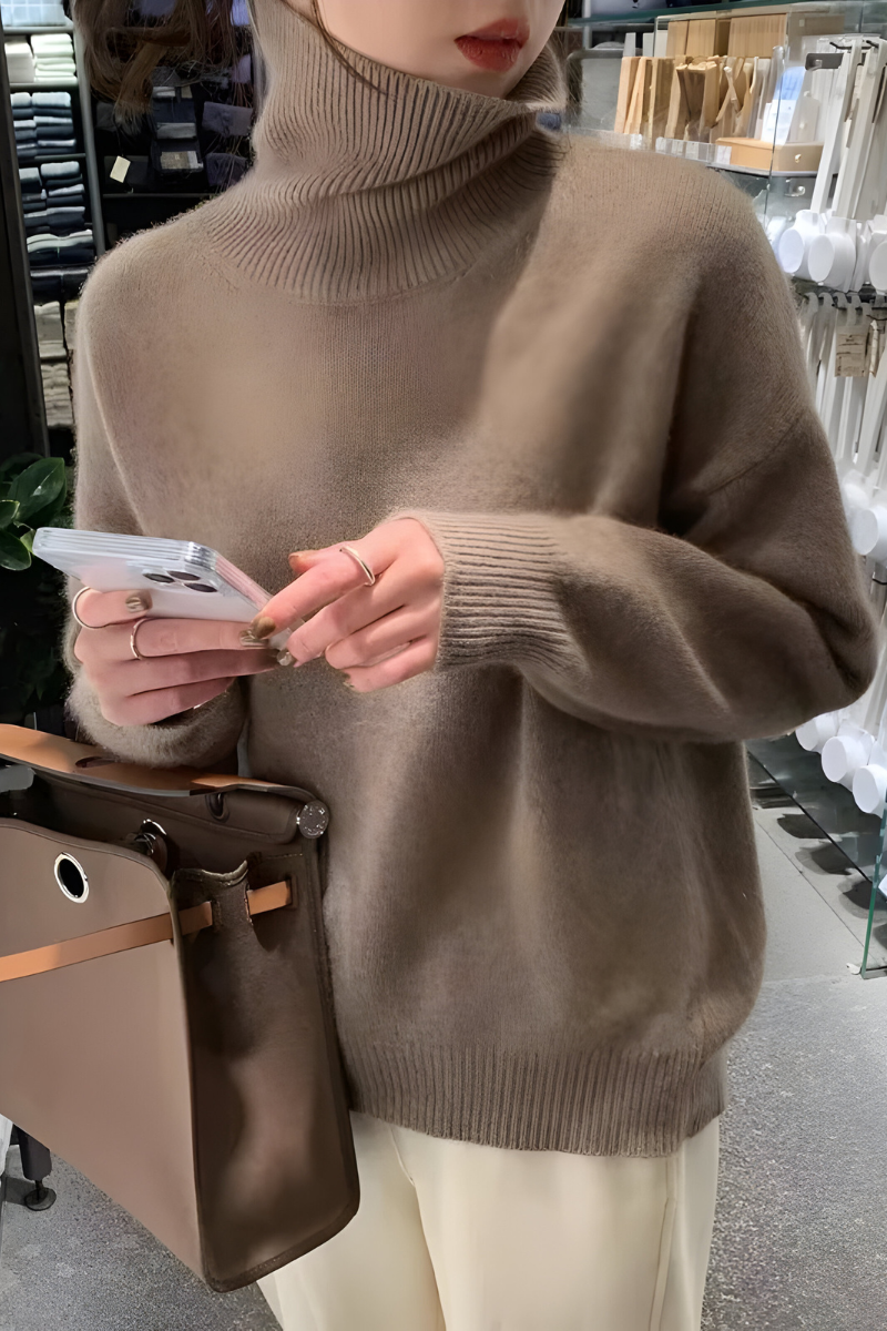 Women’s roll-neck jumper in brown with high knitted collar, styled for casual and smart-casual outfits.