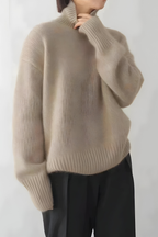 Women’s roll-neck jumper in khaki with high knitted collar, styled for casual and smart-casual outfits.