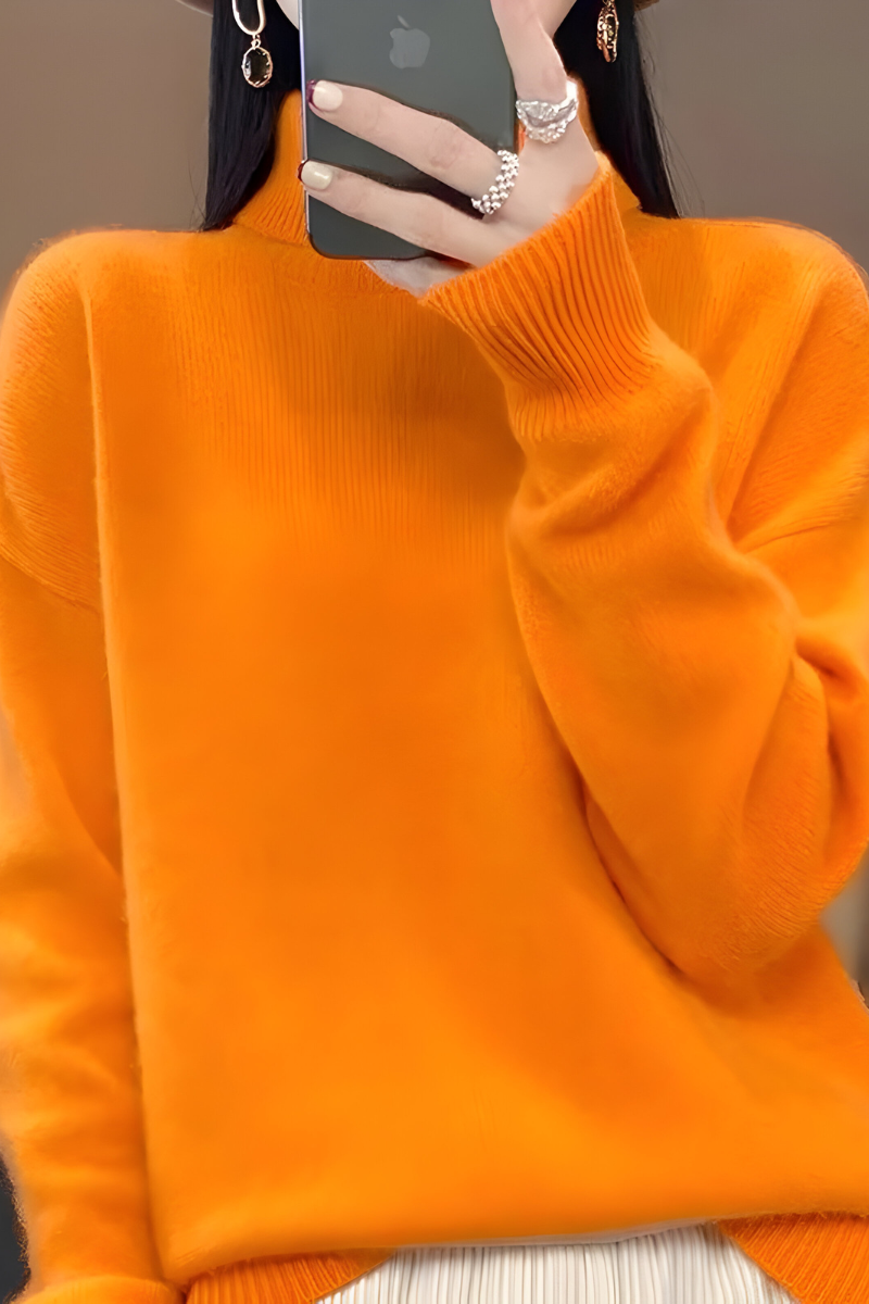 Women’s roll-neck jumper in orange with high knitted collar, styled for casual and smart-casual outfits.