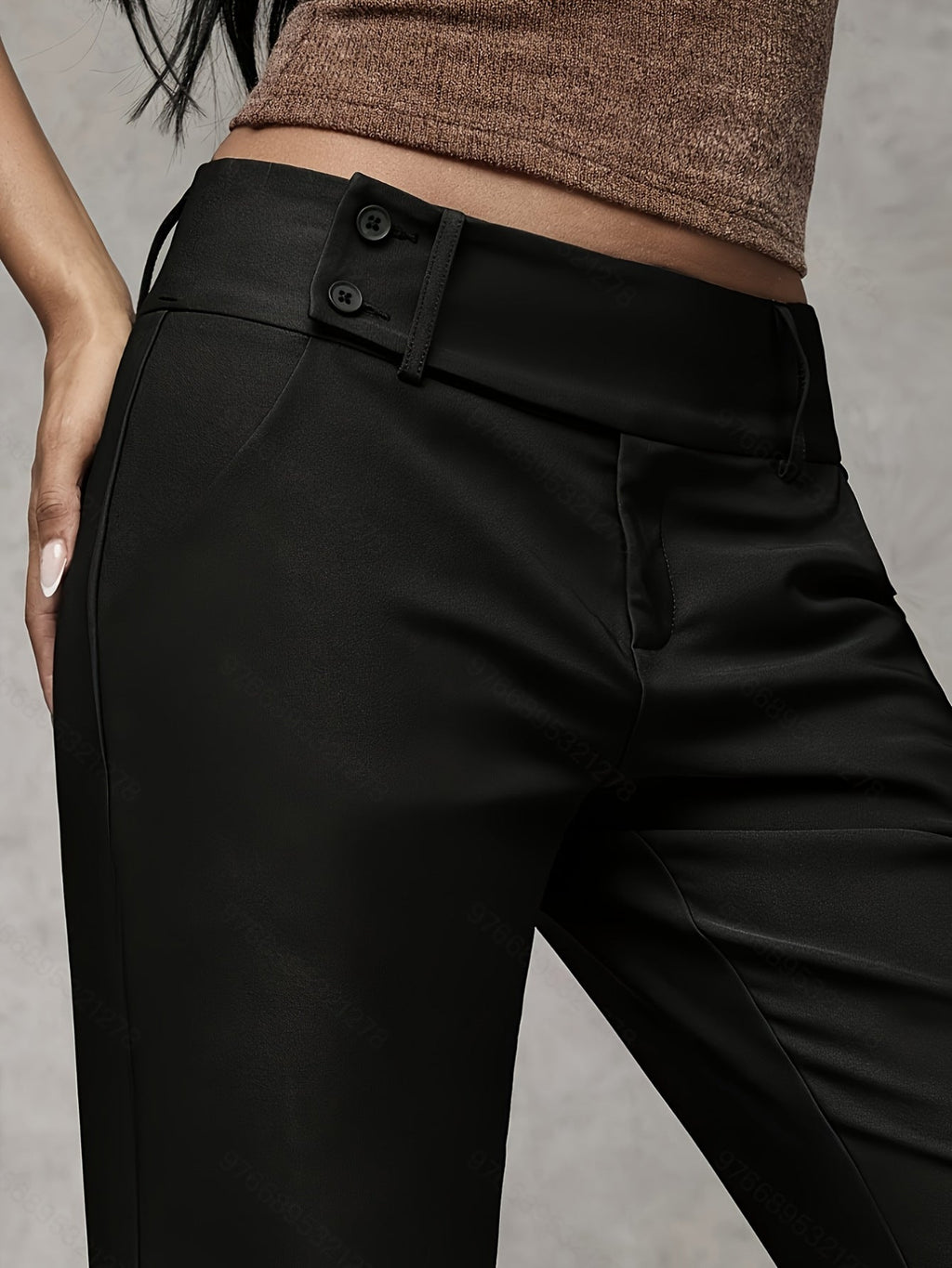 Women's loose fit trousers in black with a high waistband, styled for casual and smart-casual outfits.