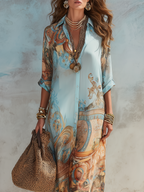 Women's shirt dress in blue with printed maxi skirt, styled for casual and smart-casual outfits.