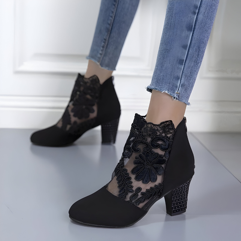 Women's orthopaedic heels in black with a wide toe box, styled for casual and smart-casual outfits.