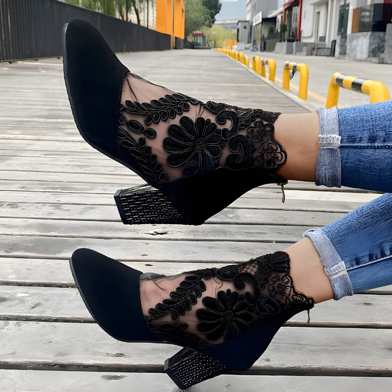 Women's orthopaedic heels in black with a wide toe box, styled for casual and smart-casual outfits.