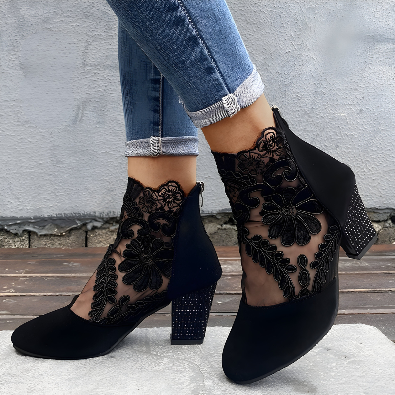 Women's orthopaedic heels in black with a wide toe box, styled for casual and smart-casual outfits.