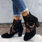 Women's orthopaedic heels in black with a wide toe box, styled for casual and smart-casual outfits.