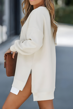 Women’s oversized jumper in apricot with side zip detail, styled for casual and smart-casual outfits.