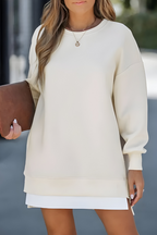 Women’s oversized jumper in apricot with side zip detail, styled for casual and smart-casual outfits.