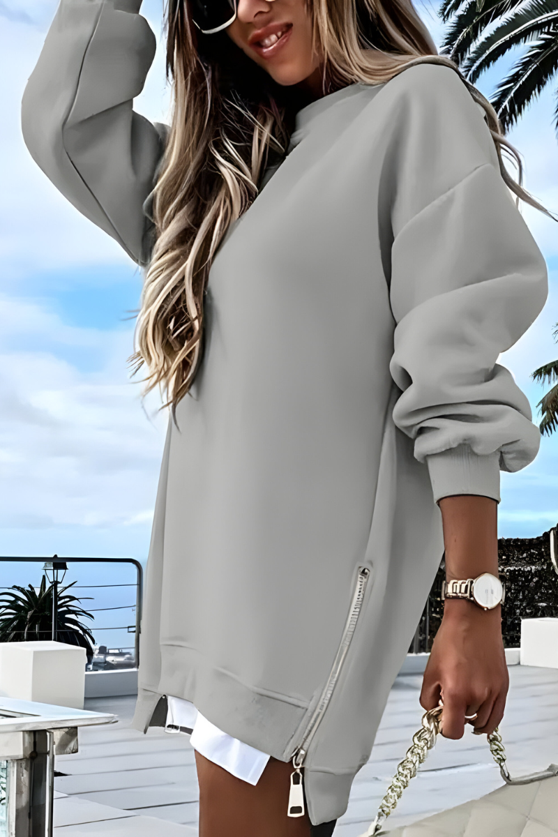 Women’s oversized jumper in grey with side zip detail, styled for casual and smart-casual outfits.