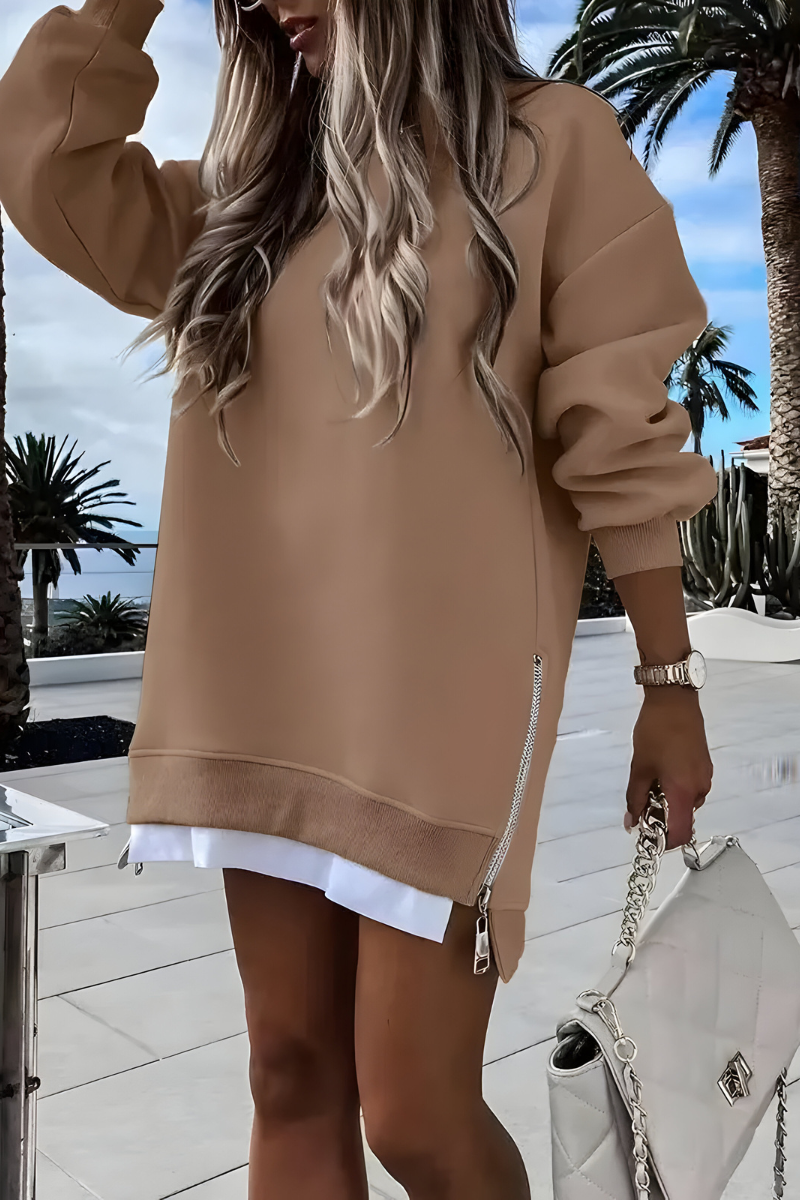 Women’s oversized jumper in khaki with side zip detail, styled for casual and smart-casual outfits.